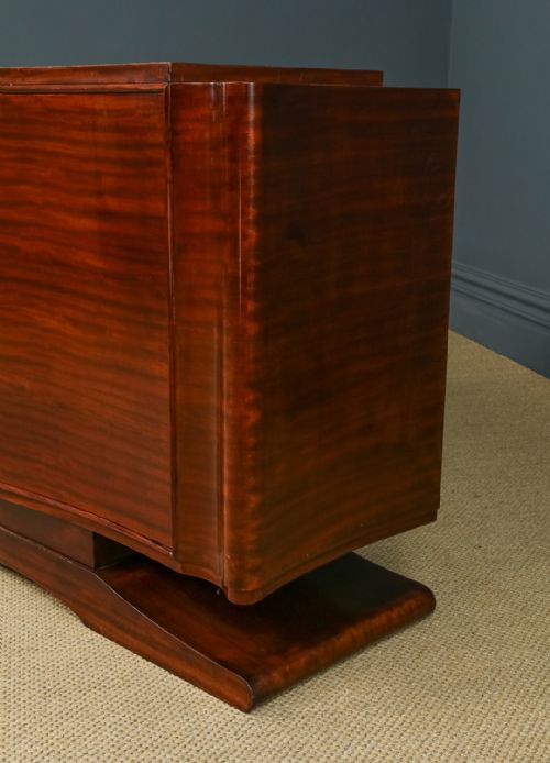 fig 7. An Art Deco mahogany sideboard featuring a serpentine front, central diamond parquetry door in maple, and streamlined metal handles.