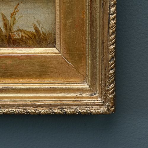 fig 9. A 19th-century framed oil painting depicting Windsor Castle across a river with figures and a horse in the foreground, set within a gilded moulded frame with an artist nameplate.