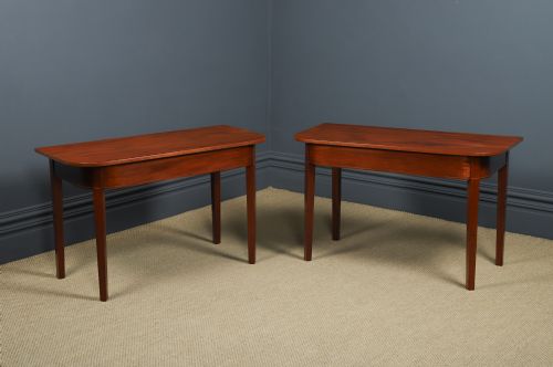 fig 1. A pair of Georgian mahogany D-shaped console tables standing on square tapered legs.