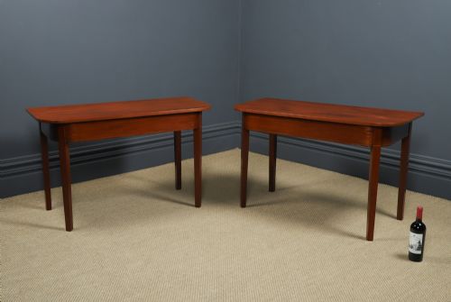 fig 2. A pair of Georgian mahogany D-shaped console tables standing on square tapered legs.