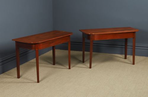 fig 3. A pair of Georgian mahogany D-shaped console tables standing on square tapered legs.