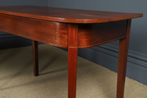 fig 6. A pair of Georgian mahogany D-shaped console tables standing on square tapered legs.