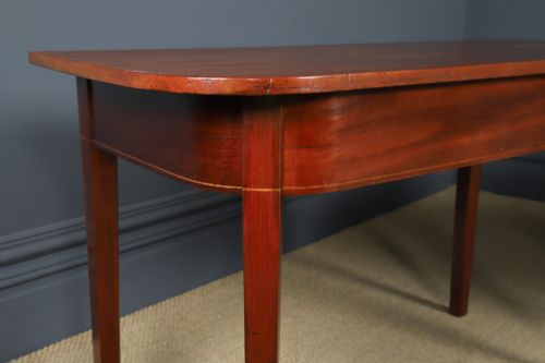 fig 8. A pair of Georgian mahogany D-shaped console tables standing on square tapered legs.