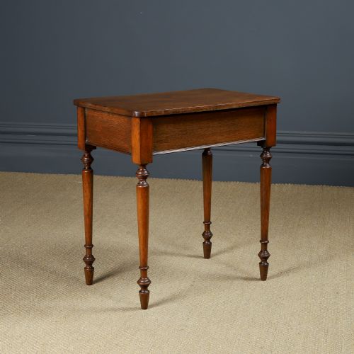 fig 2. A small rectangular Victorian oak side table with slender turned legs and a dark brown wax finish.