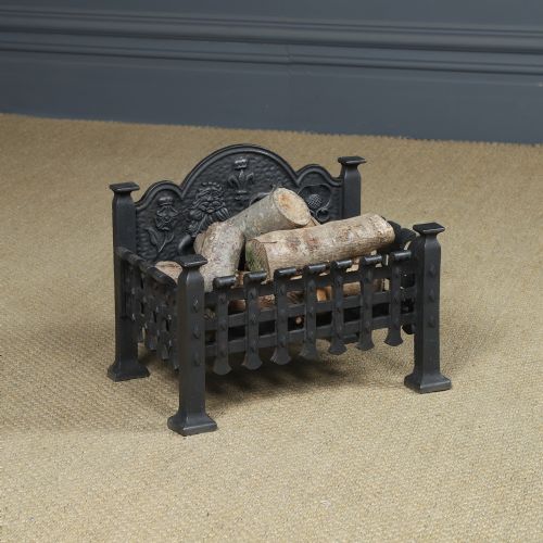 fig 2. A black cast iron fire grate featuring a relief-carved heraldic lion backplate and portcullis lattice front basket.