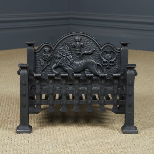 fig 3. A black cast iron fire grate featuring a relief-carved heraldic lion backplate and portcullis lattice front basket.