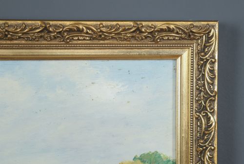 fig 5. A framed landscape painting depicting a serene river flowing through green foliage and trees, presented in an ornate gilt frame.