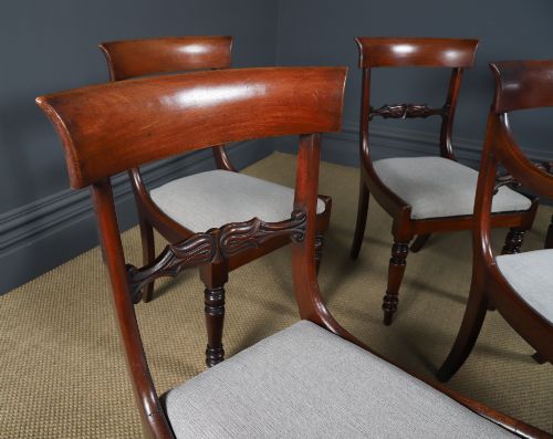 fig 2. A set of six mahogany Regency dining chairs featuring carved back rails, turned front legs, and light-coloured upholstered seats.