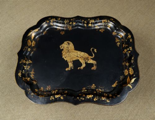fig 5. An ebonised Victorian papier-mache tray table featuring gilt Chinoiserie decoration and a lion motif, resting on a faux-bamboo base.