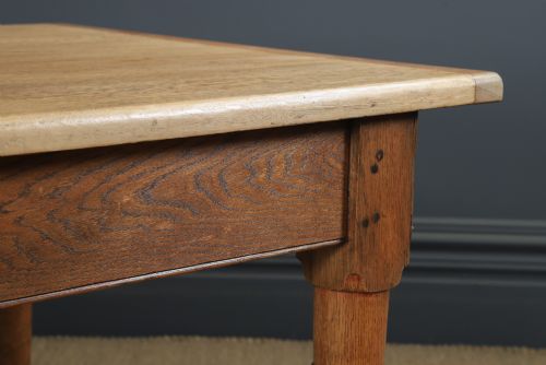 fig 2. A long Victorian 19th-century refectory dining table with a light pitch pine top and dark oak frame on turned legs.