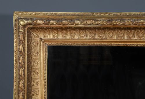 fig 2. A rectangular Victorian gilt wall mirror featuring a moulded frame with classical leaf and beaded details.