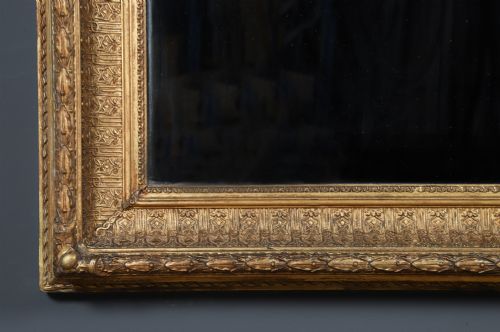 fig 3. A rectangular Victorian gilt wall mirror featuring a moulded frame with classical leaf and beaded details.