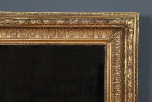 fig 5. A rectangular Victorian gilt wall mirror featuring a moulded frame with classical leaf and beaded details.