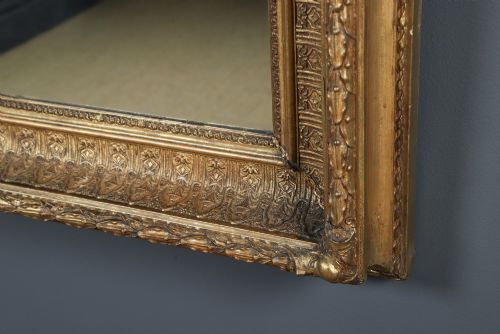 fig 7. A rectangular Victorian gilt wall mirror featuring a moulded frame with classical leaf and beaded details.