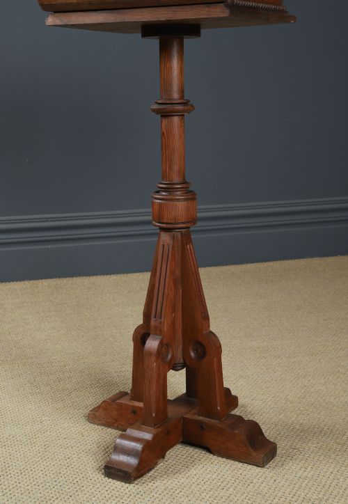 fig 3. An antique Victorian pitch pine lectern featuring a slanted book rest, turned central column, and a Gothic-style pedestal base.