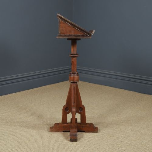 fig 8. An antique Victorian pitch pine lectern featuring a slanted book rest, turned central column, and a Gothic-style pedestal base.