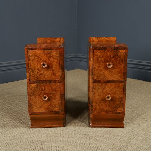 fig 6. A pair of narrow Art Deco burr walnut bedside cabinets featuring two drawers with carved circular handles and a low back ledge.