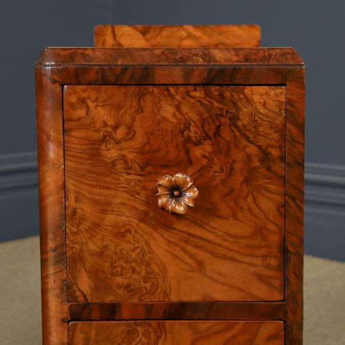 fig 7. A pair of narrow Art Deco burr walnut bedside cabinets featuring two drawers with carved circular handles and a low back ledge.