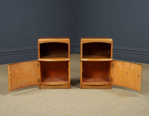 fig 6. A pair of Art Deco walnut bedside tables with an upper open compartment and a lower cupboard featuring a round green handle.