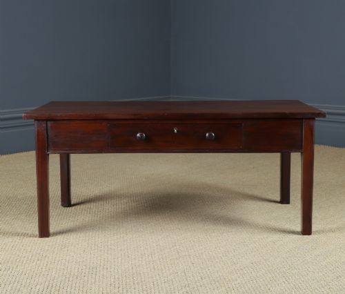 fig 4. An antique rectangular dark mahogany low coffee table featuring a single drawer with two turned handles and a brass keyhole.