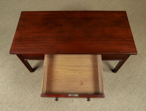 fig 5. An antique rectangular dark mahogany low coffee table featuring a single drawer with two turned handles and a brass keyhole.