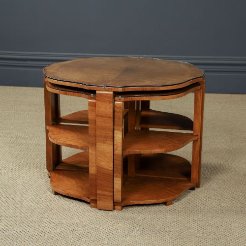 fig 4. An Art Deco round walnut nest of five occasional tables featuring four quadrant side tables fitted beneath a central coffee table top.