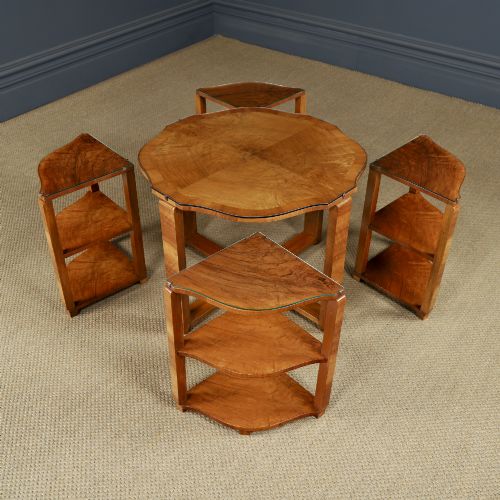 fig 6. An Art Deco round walnut nest of five occasional tables featuring four quadrant side tables fitted beneath a central coffee table top.