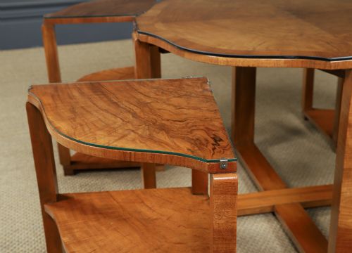 fig 7. An Art Deco round walnut nest of five occasional tables featuring four quadrant side tables fitted beneath a central coffee table top.