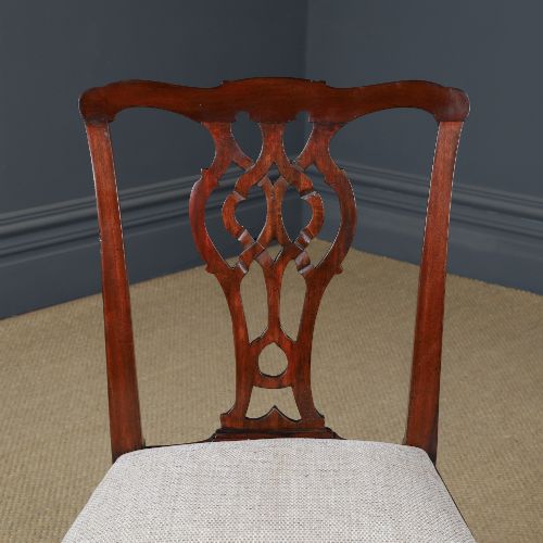 fig 1. A Georgian mahogany side chair with a pierced carved back splat, square legs connected by stretchers, and a neutral textured seat upholstery.