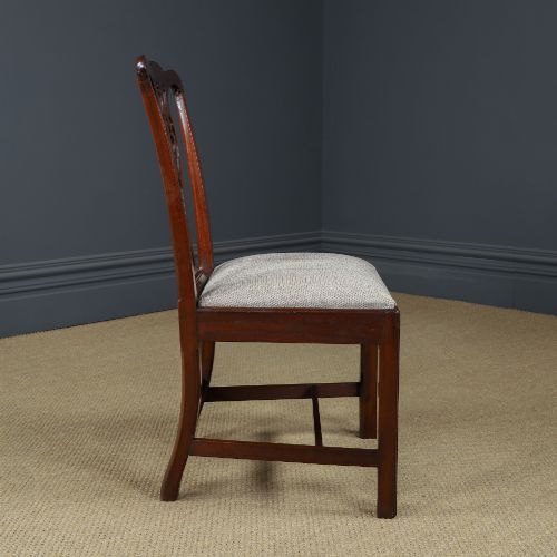 fig 5. A Georgian mahogany side chair with a pierced carved back splat, square legs connected by stretchers, and a neutral textured seat upholstery.