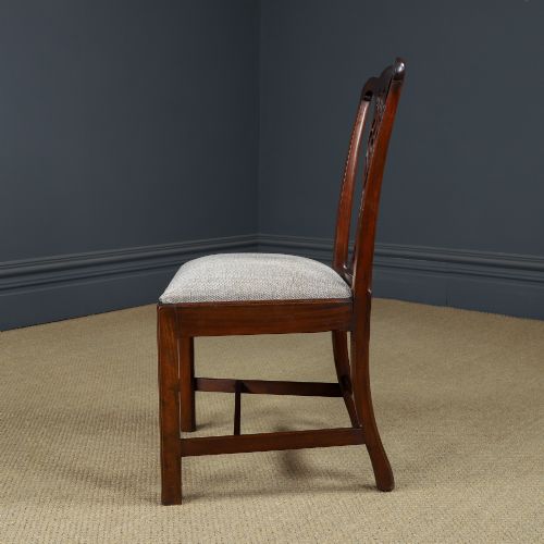 fig 6. A Georgian mahogany side chair with a pierced carved back splat, square legs connected by stretchers, and a neutral textured seat upholstery.