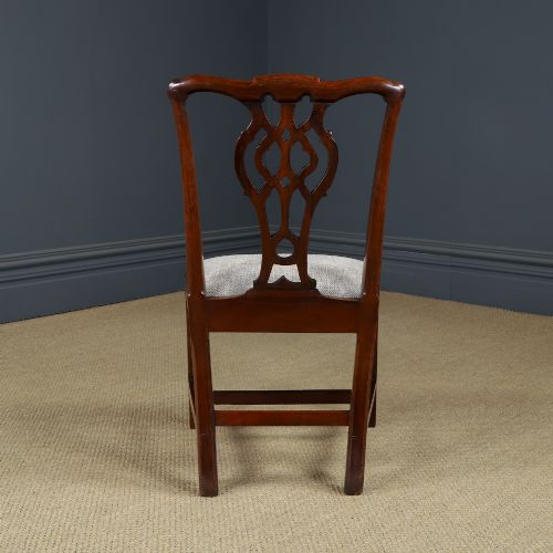 fig 7. A Georgian mahogany side chair with a pierced carved back splat, square legs connected by stretchers, and a neutral textured seat upholstery.