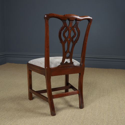 fig 8. A Georgian mahogany side chair with a pierced carved back splat, square legs connected by stretchers, and a neutral textured seat upholstery.