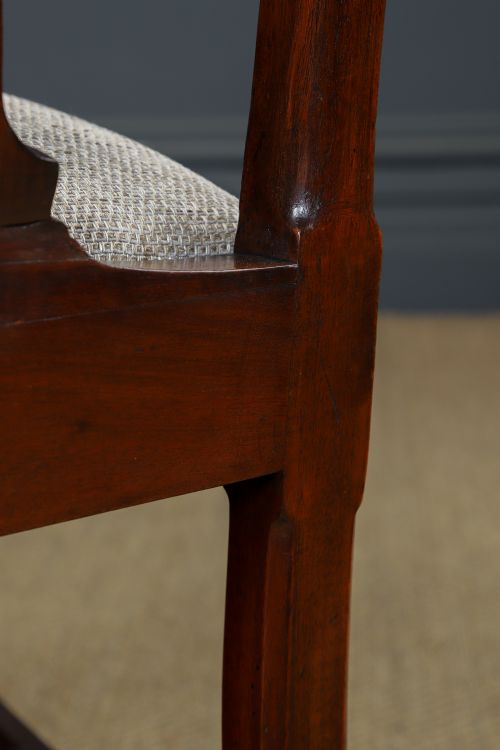 A Georgian mahogany side chair with a pierced carved back splat, square legs connected by stretchers, and a neutral textured seat upholstery. View XI