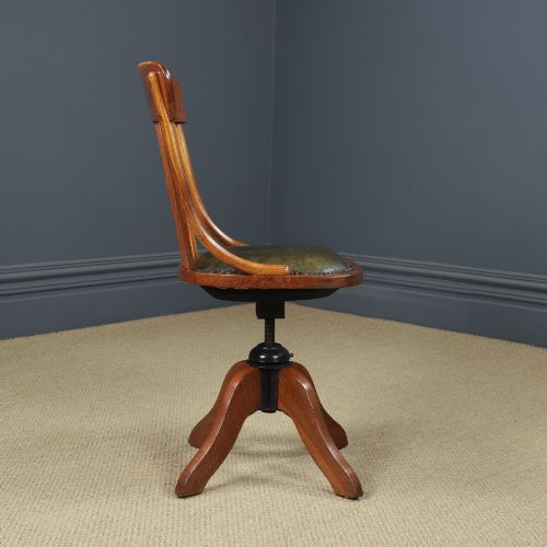 fig 6. A George V period golden oak revolving desk chair featuring a curved spindle backrest, quadruped base, and a padded green leather seat secured with brass studs.
