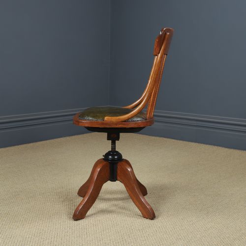 fig 7. A George V period golden oak revolving desk chair featuring a curved spindle backrest, quadruped base, and a padded green leather seat secured with brass studs.