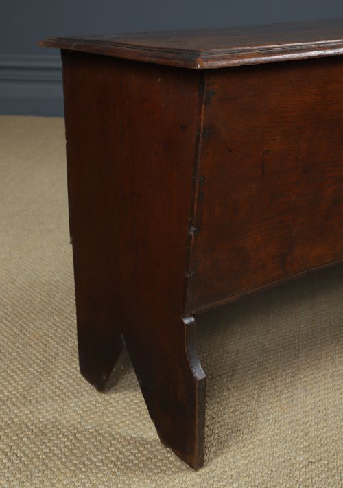 fig 1. A rectangular dark brown oak six-plank coffer featuring V-cut side legs and iron keyhole escutcheon detail.
