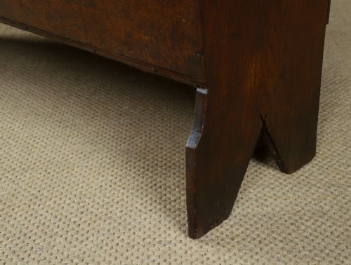 fig 7. A rectangular dark brown oak six-plank coffer featuring V-cut side legs and iron keyhole escutcheon detail.