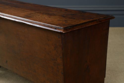 fig 8. A rectangular dark brown oak six-plank coffer featuring V-cut side legs and iron keyhole escutcheon detail.