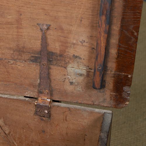 fig 9. A rectangular dark brown oak six-plank coffer featuring V-cut side legs and iron keyhole escutcheon detail.