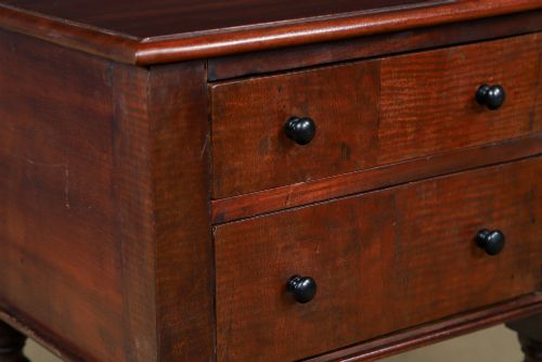 fig 2. A pair of tall Victorian mahogany bedside tables featuring two small drawers with black knobs, turned legs, and a concave lower shelf.