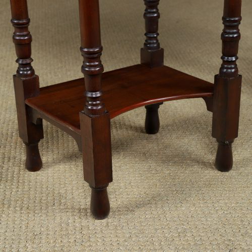 fig 4. A pair of tall Victorian mahogany bedside tables featuring two small drawers with black knobs, turned legs, and a concave lower shelf.