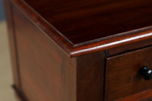 fig 6. A pair of tall Victorian mahogany bedside tables featuring two small drawers with black knobs, turned legs, and a concave lower shelf.