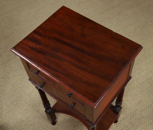 fig 8. A pair of tall Victorian mahogany bedside tables featuring two small drawers with black knobs, turned legs, and a concave lower shelf.