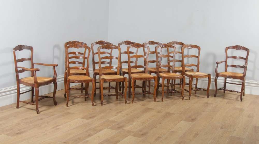 Antique Set of 12 French Louis XV Style Oak Ladder Back Rush Seat Kitchen Dining Chairs (Circa 1910)