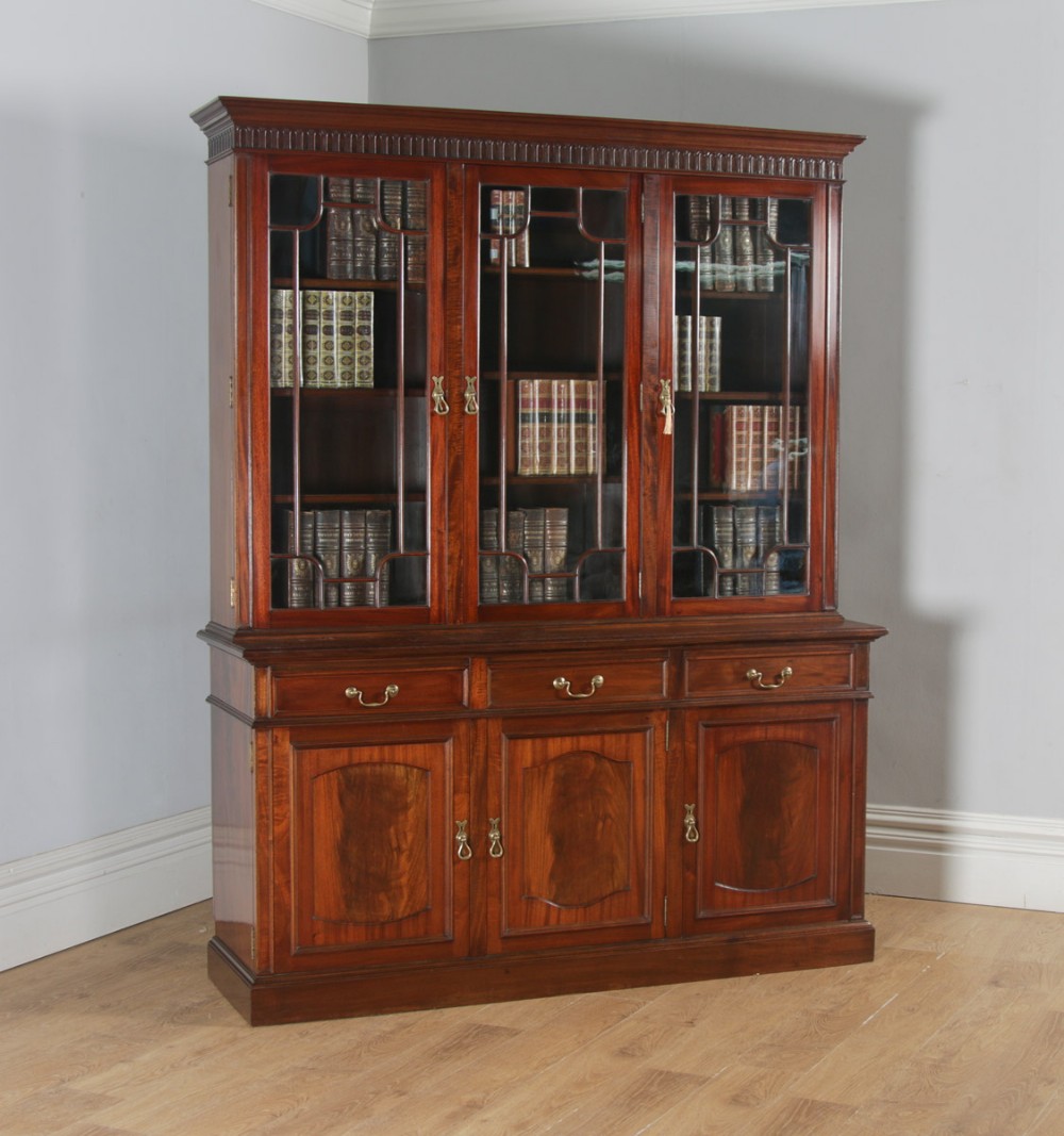 Antique English Georgian Style Flame Mahogany Glazed Library Office Bookcase Cupboard by S&H Jewell of London (Circa 1900)