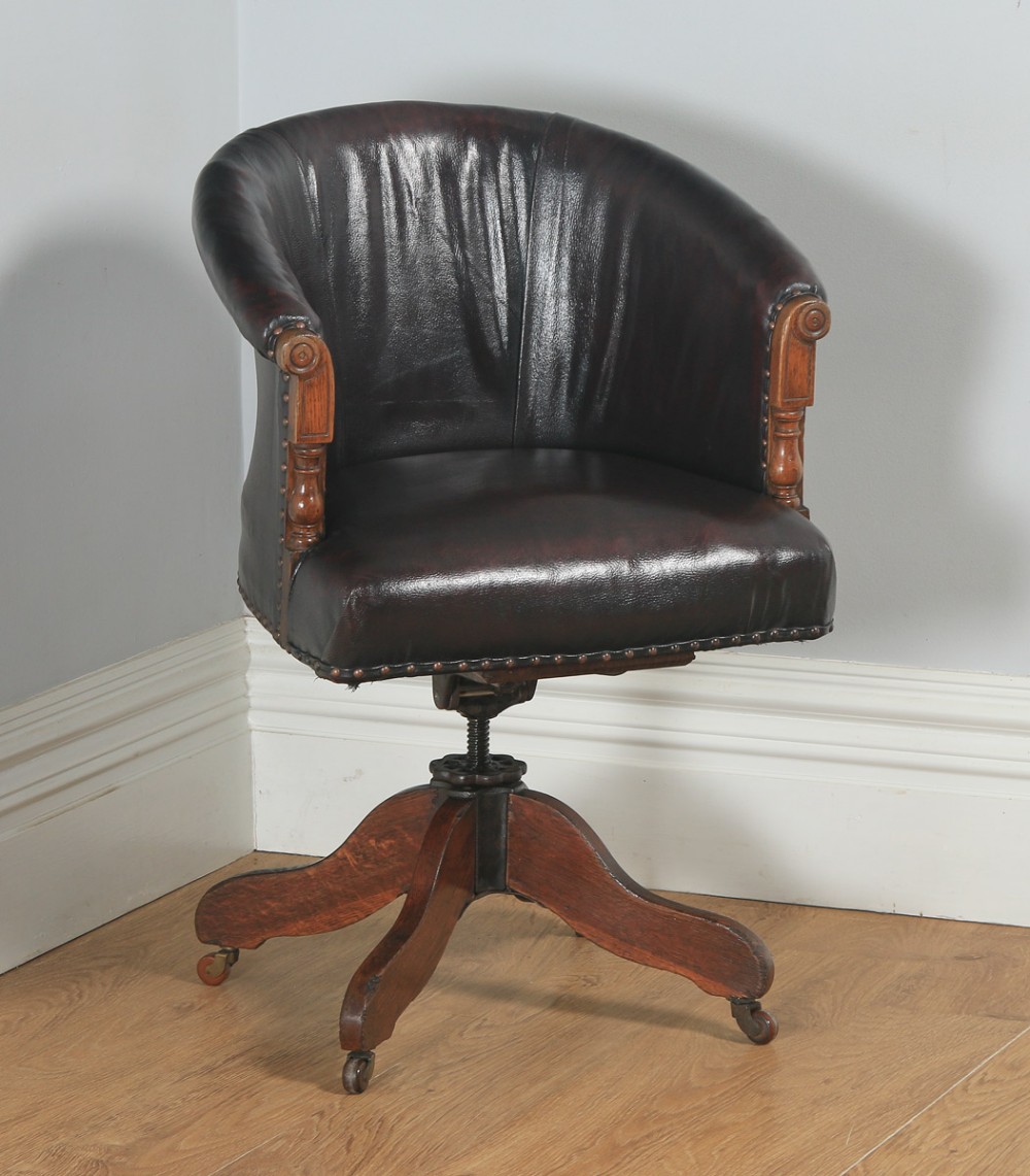 Antique English Edwardian Oak & Red Oxblood Leather Style Revolving Adjustable Office Desk Arm Tub Chair (Circa 1910)