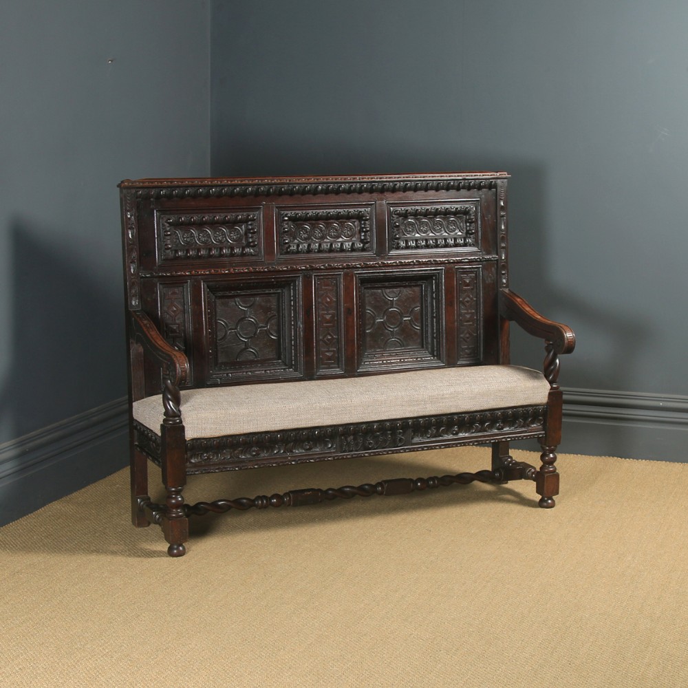 Antique English 17th Century Style Victorian Oak Carved High Back Panelled Upholstered Settle (Circa 1870)