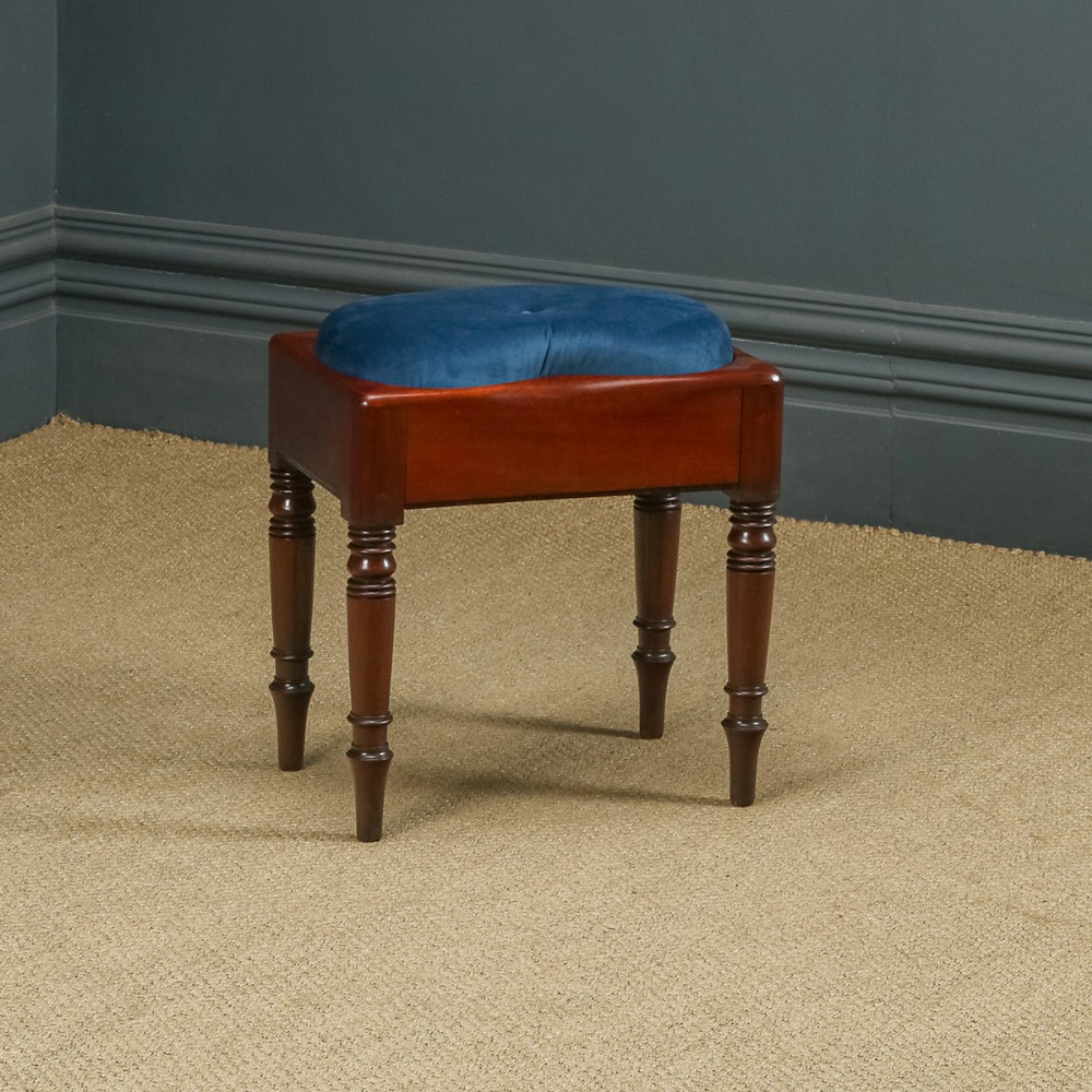 Here is a fine quality antique English Georgian mahogany stool, with a newly upholstered shaped seat, incorporating a storage area, circa 1820, in excellent condition.