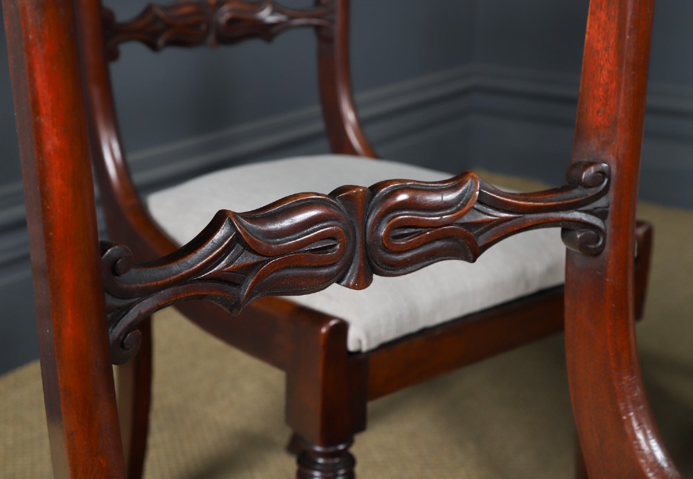 A set of six mahogany Regency dining chairs featuring carved back rails, turned front legs, and light-coloured upholstered seats. View IV
